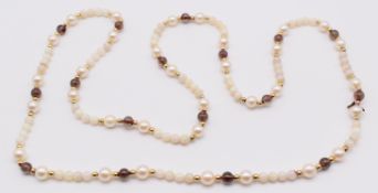 A single strand of cultured pearls, opal beads, gold beads and glass beads, 18.8g, 68cm
