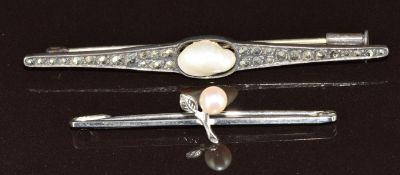 A 9ct white gold brooch set with a pearl (1.3g) and a silver brooch set with marcasite and a blister