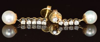A pair of 18k gold earrings each set with a pearl and five diamonds, 3.1g