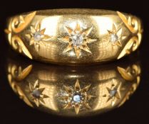 An 18ct gold ring set with three diamonds, Birmingham 1924, 2.2g, size L