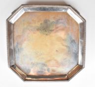 Art Deco hallmarked silver octagonal tray or salver raised on four feet, Sheffield 1933, maker