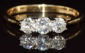 An 18ct gold ring set with three old cut diamonds of approximately 0.3ct, 0.2ct & 0.2ct, 3.1g,