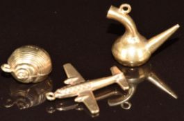 An 18ct gold charm in the form of a pipe (1.7g), and two 9ct gold charms, one in the form of a plane