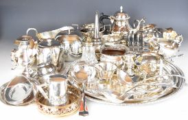 Silver plated ware including a large circular pierced tray, tea ware, gravy and sauce boats,