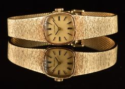 Longines 9ct gold ladies wristwatch with black hands, two-tone hour markers, gold dial and signed