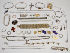 A collection of silver jewellery including five bracelets, christening bangle, fourteen rings,
