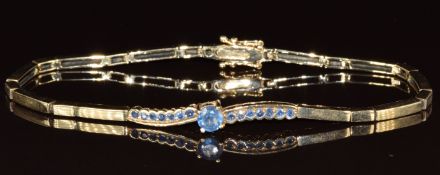 A 9ct gold bracelet set with sapphires, 9.6g, 19cm