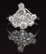 An 18ct white gold ring set with a cluster of old cut diamonds, the largest approximately 0.28ct,