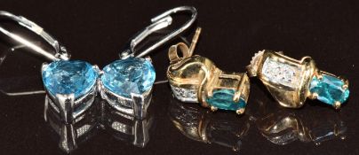 A pair of 9k white gold earrings each set with a 2ct heart cut London blue topaz, and a pair of