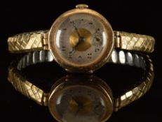 Unnamed 9ct gold ladies wristwatch with subsidiary seconds dial, blued hands, black Arabic numerals,