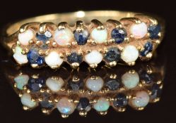 A 9ct gold ring set with round cut sapphires and opals, 2g, size N