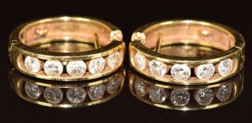 A pair of 18k gold earrings each set with five diamonds of approximately 0.1ct each, 6.2g