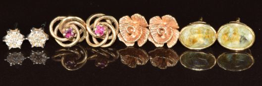Four pairs of 9ct gold earrings including diamond, topaz and ruby, 6.4g
