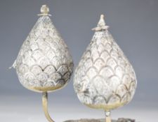Burmese or similar silver novelty cruet set comprising pierced and embossed stand with two hinged
