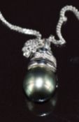 An 18k white gold pendant set with a Tahitian peal and diamonds, on 18k white gold chain, 5.1g