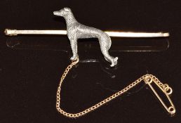A 9ct gold and silver brooch depicting a greyhound, 6.3g, 5.5cm