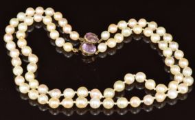 A double strand cultured pearl necklace / choker, the 9ct gold clasp set with two foiled