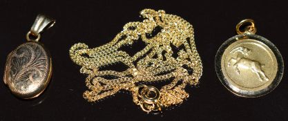 A 9ct gold pendant depicting a ram for Aries, 9ct gold chain and 9ct gold locket, 6.8g