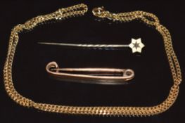 An 18ct gold chain (6.7g, 44cm), 15ct gold brooch (2.6g, 3.7cm) and a 9ct gold stick pin set with