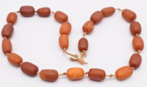 Baltic amber necklace made up of barrel shaped beads, 34g
