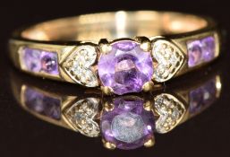 A 9ct gold ring set with amethysts and diamonds, 2.1g, size M