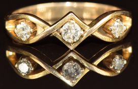 A 14k gold ring set with three diamonds, the largest approximately 0.1ct, 2.7g, size N