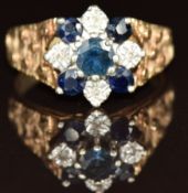 A 9ct gold ring set with diamonds and sapphires in a cluster, 4.1g, size N