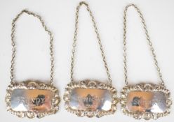 Set of three hallmarked silver bottle tickets or labels, comprising sherry, whisky and brandy,