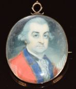 Georgian portrait miniature of a distinguished gentleman in yellow metal setting with heart motif