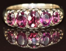 Victorian yellow metal ring set with five garnets, 4.2g, size P