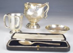 Hallmarked silver items comprising twin handled trophy cup, christening mug and a pin dish and a