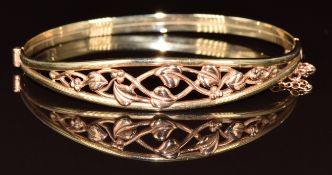 Clogau 9ct gold bangle with pierced foliate decoration, 11.1g, 5.7 x 5.3cm