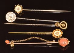 Three c1900 15ct gold stick pins set with a diamond to each, 15ct gold stick pin (5.4g) and a 9ct