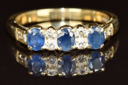 A 9ct gold ring set with oval cut sapphires and diamonds,  3.6g, size L