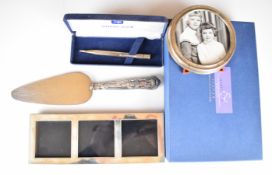 Modern hallmarked silver triple photograph frame, length 21.5cm, in original Martin & Co. Cheltenham