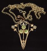 Edwardian 9ct gold pendant set with three peridot and seed pearls on 9ct gold chain, 4.8g, 55cm