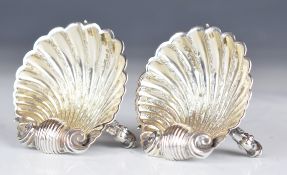 Pair of George Unite Victorian hallmarked silver novelty salts formed as shells, each raised on