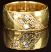 An 18ct gold ring set with six diamonds, 9.4g, size L