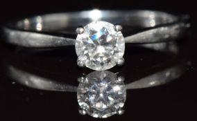A platinum ring set with a round brilliant cut diamond of approximately 0.44ct, with GIA