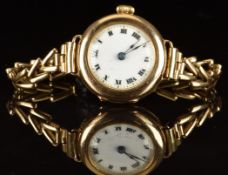Unnamed 9ct gold ladies wristwatch with blued hands, black Roman numerals, gilt minute markers,