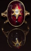 Victorian yellow metal ring set with a foiled garnet cabochon, with an old cut diamond in a star
