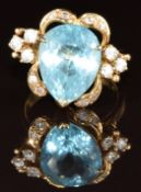 An 18k gold ring set with a pear cut topaz and cubic zirconia, 7.8g, size N