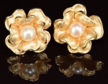 A pair of 14k gold earrings by Cetas in the form of a flower each set with a cultured pearl, 7g