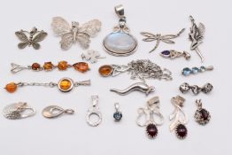 Twenty silver pendants including amber, garnet, labradorite, amethyst, etc