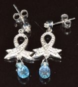 A pair of 9ct white gold earrings each set with a diamond and drop briolette cut aquamarine, 2.3g