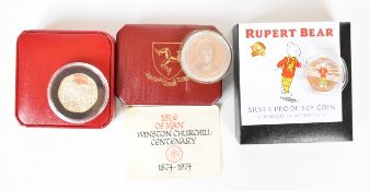 Three cased coins including silver Churchill crown