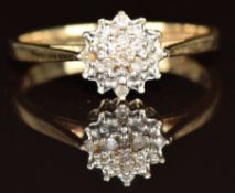 A 9ct gold ring set with diamonds in a cluster, 1.8g, size M