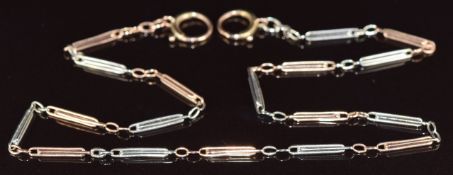 A 9ct bi-coloured fob chain / necklace made up of alternating rose gold and white gold elongated
