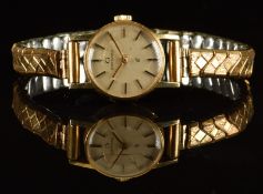 Garrard 9ct gold ladies wristwatch with gold hands and hour markers, silver dial and quartz