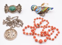 A c1900 necklace made up of coral beads and natural pearls, silver St Christopher, silver brooch
